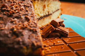 sweet cake and chocolate chips on a blue plate