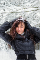 Fototapeta na wymiar Portrait of young woman in a winter forest
