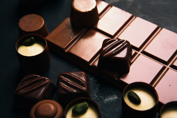 Many chocolate sweets with  Pistachio on black background