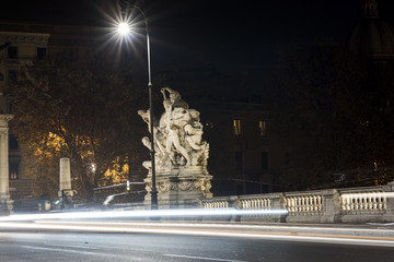 image of a bridge in Rome with winged victories travertine. Rome by night