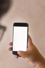 Shadow of glasses  use of the mobile phone with blank screen