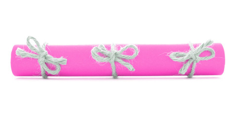Pink message scroll tied with rope, three natural nodes isolated