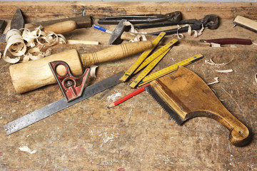 carpenter working with plane on wooden