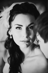 Obraz premium Black white photography beautiful young couple standing near the window