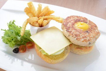 The Burger Ring with egg and french fries