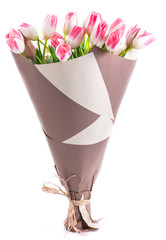 bouquet of pink tulips in a package of kraft paper, shallow DOF