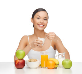 young woman eating healthy breakfast