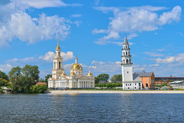 Fototapeta na wymiar Transfiguration Cathedral and Leaning Tower on the shore of the pond in Nevyansk, Sverdlovsk Oblast, Russia