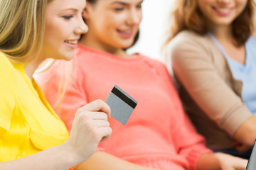 close up of women or friends with credit card