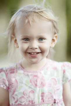 Portrait of smiling blond little girl