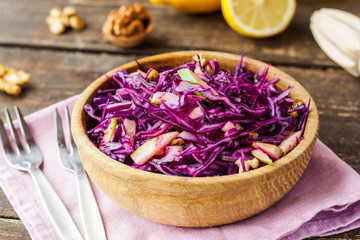 salad of red cabbage, apples and walnuts © yuliiaholovchenko