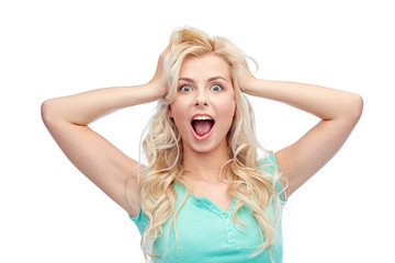 smiling young woman holding to her head or hair