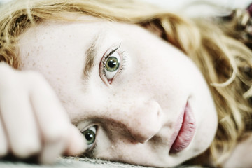 Portrait of girl with freckles and green eyes