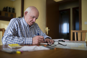 Senior man planning a trip with road map