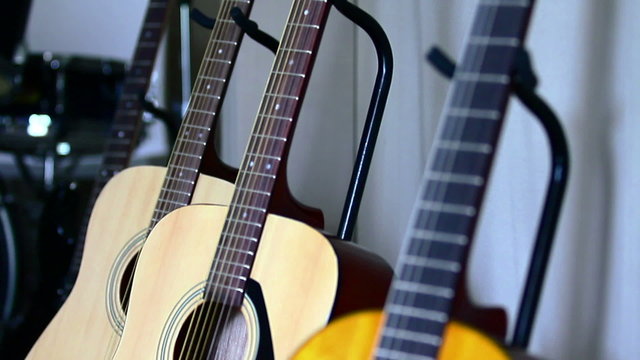 Acoustic guitars standing in a music room