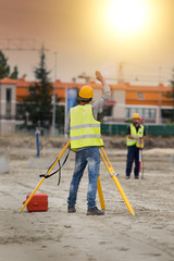 Workers with theodolite