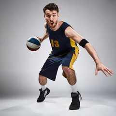 Fotobehang Full length portrait of a basketball player with ball  © master1305