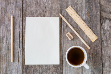 Obraz na płótnie Canvas Open notebook on wooden background with coffee cup and yellow no
