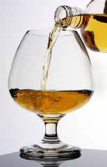 POURING GLASS OF BRANDY