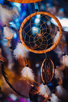 Dream catcher on the bright multicolored background