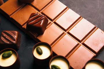 Many chocolate sweets with  Pistachio on black background