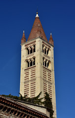 Fototapeta na wymiar Basilica of San Zeno in Verona romanesque belfry with typical conical spire