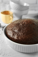 Cooked chocolate pie in a baking tray on a table