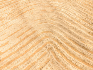 abstract curve lines write on the sand in outdoor park