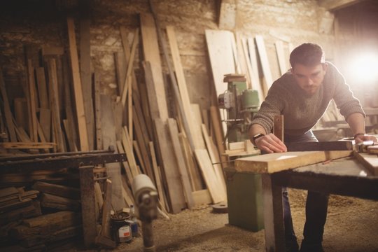 Carpenter working in workshop