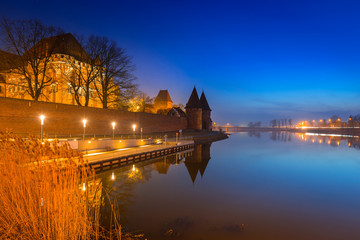 The Castle of the Teutonic Order in Malbork at dusk, Poland