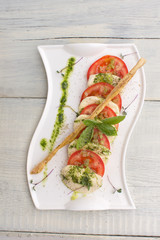 Caprese salad Tomato and mozzarella slices 
