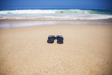 Summer slippers on the beach