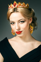 Beautiful blonde girl with a golden crown