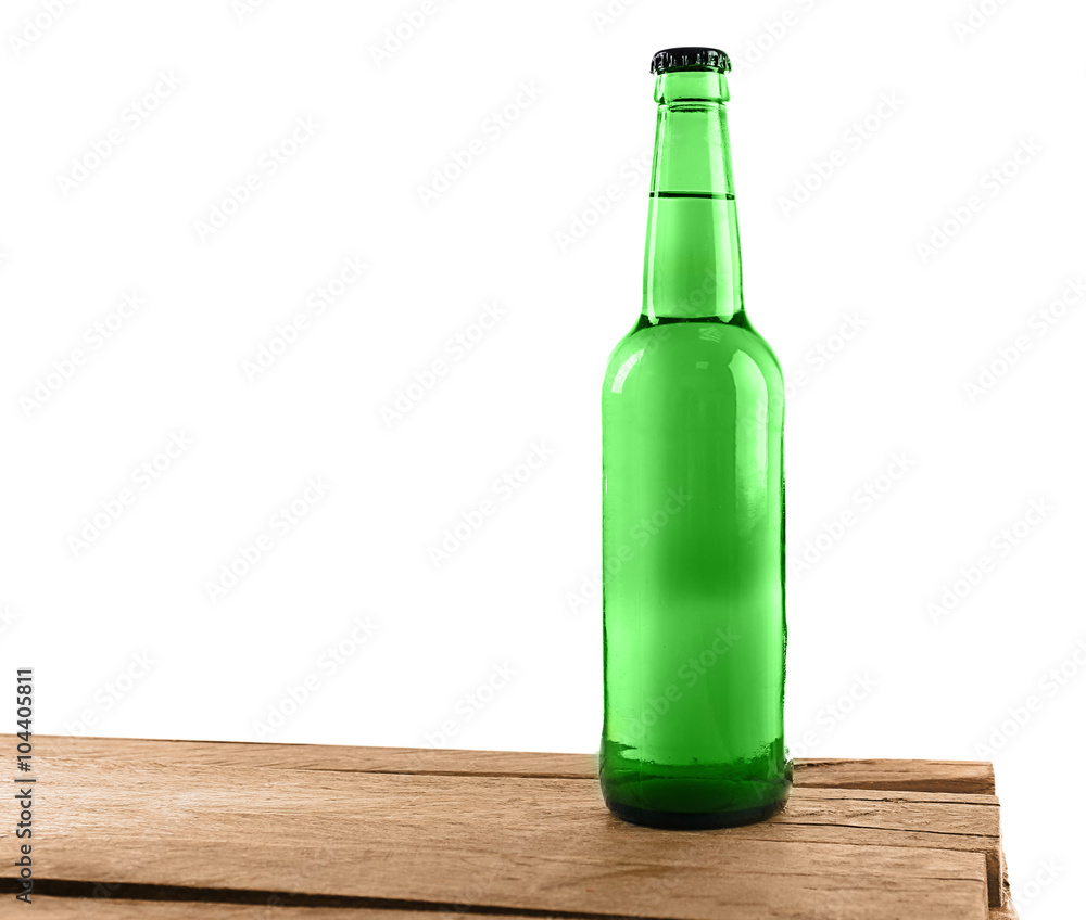 Poster green glass beer bottle on wooden table against white background