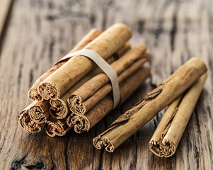 Cinnamon sticks on the wooden table.