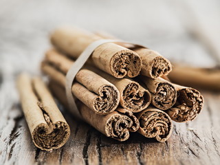 Cinnamon sticks on the wooden table.