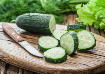 Cucumbers on the wooden table.