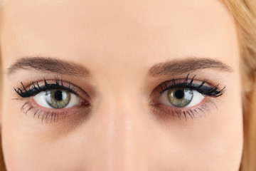 Naklejka premium Female eyes with light make-up, closeup