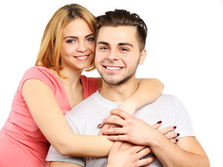Fototapeta premium Young couple in love embracing, isolated on white