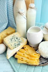 Set of fresh dairy products on blue wooden table, close up