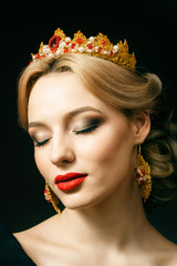 Beautiful blonde girl with a golden crown