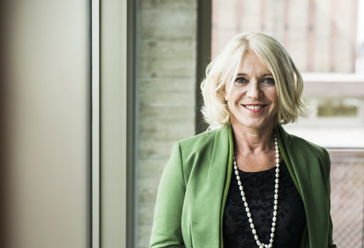 Portrait of smiling blond businesswoman