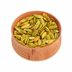 Roasted pumpkin seeds in wooden bowl