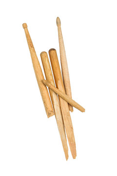 Devil horns broken wooden drumsticks on white