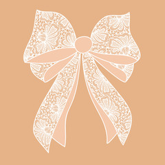 Decorative white lacy bow on beige background