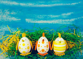 Easter motives on a blue wooden background