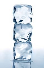 Three ice cubes on white background