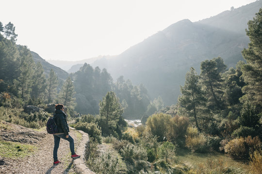 Spain, Catalonia, Parc Natural dels Ports, woman with backpack standing on hiking trail