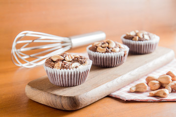 Cup of Brownies With Cashew nuts On Wooden Background