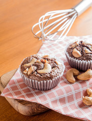 Cup of Brownies With Cashew nuts On Wooden Background